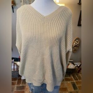 Umgee cream colored v-neck lace up back long sleeve sweater.